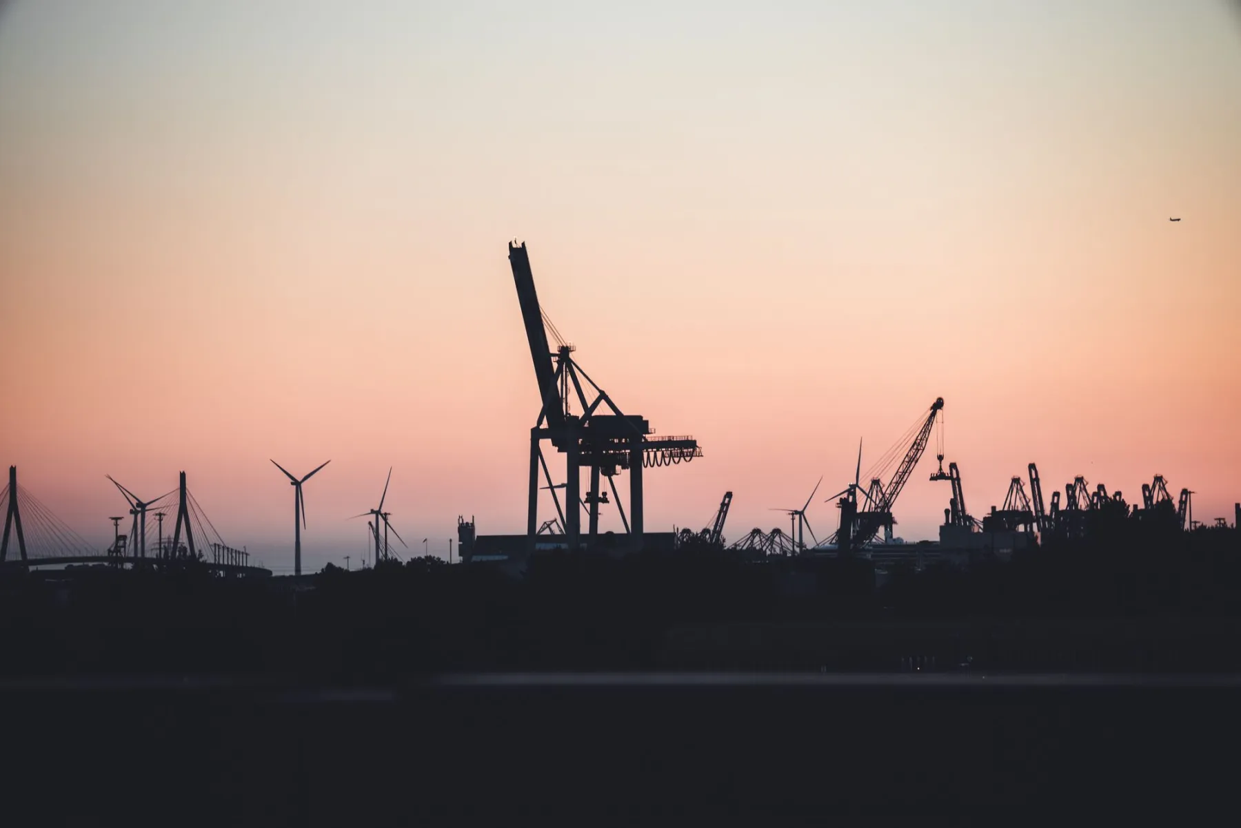Bulk-terminal gantry cranes over a loading berth at a Gulf-Coast export port